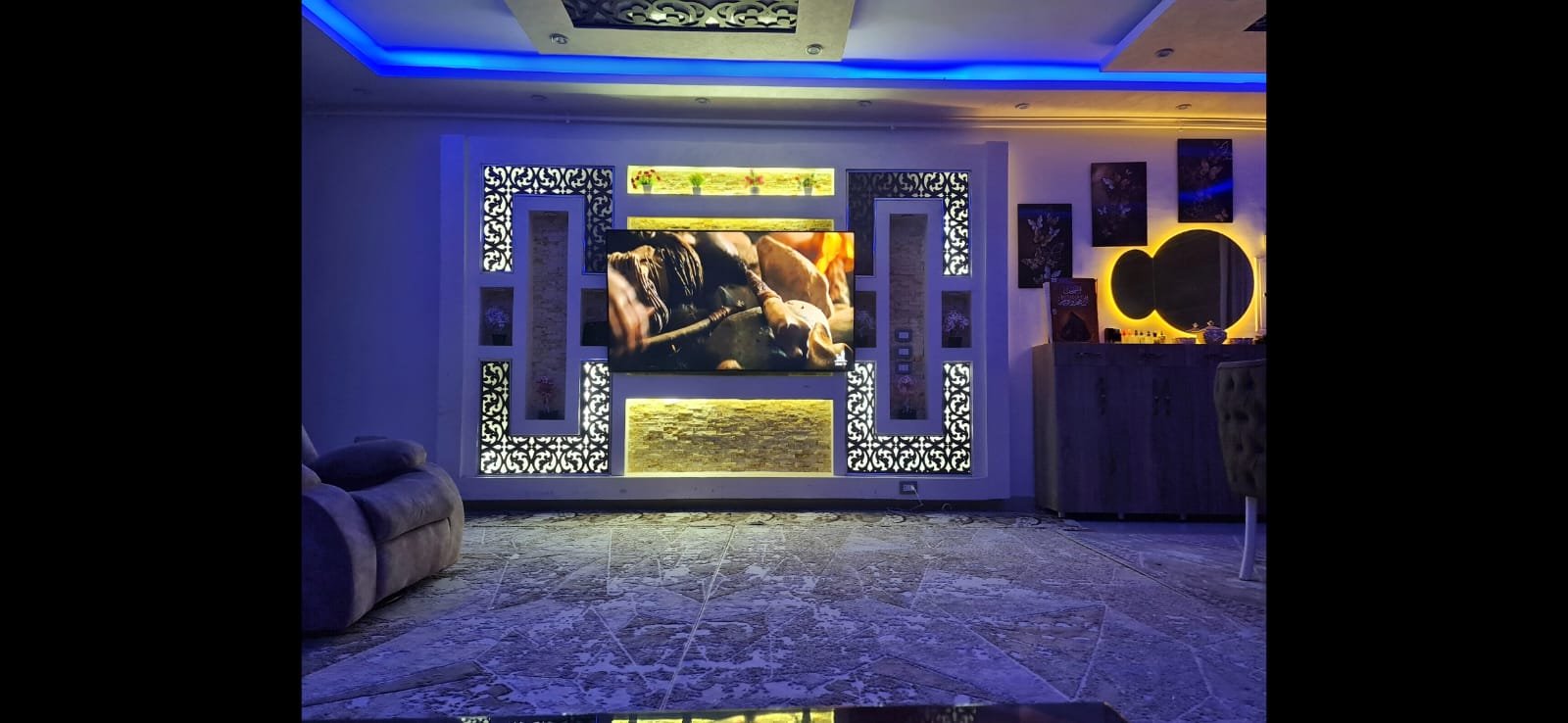 TV wall with blue lighting and decorative panels - unit in Al Banafseg 4, New Cairo