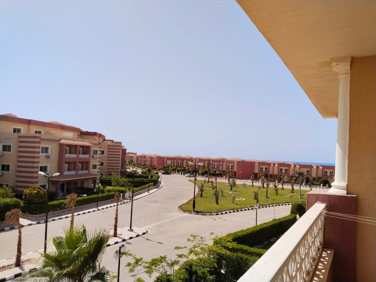 Balcony view over the resort road and buildings - chalet in Rozana, North Coast