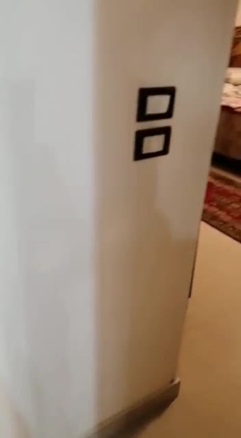 White wall corner with two black switches - apartment in South of Academy, 5th Settlement