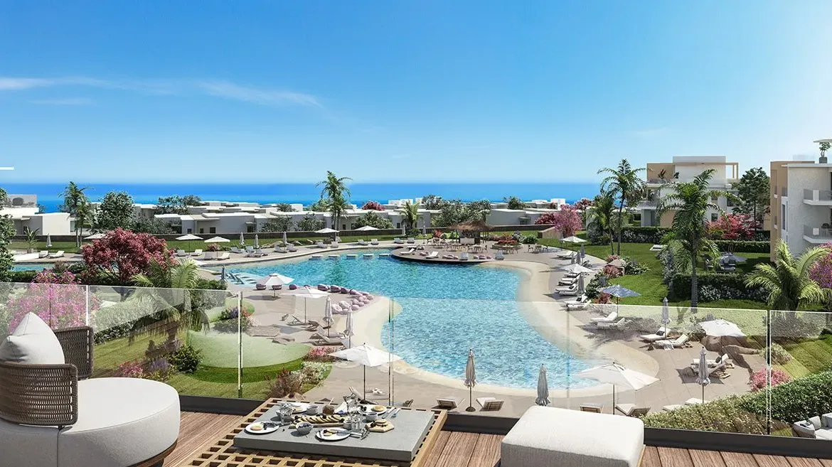 Rendering of a sandy-edged lagoon with lounge seating on a deck - chalet in Seashore, North Coast