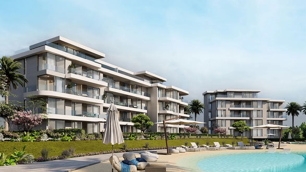 Rendering of low-rise apartment blocks beside a lagoon pool - chalet in Seashore, North Coast