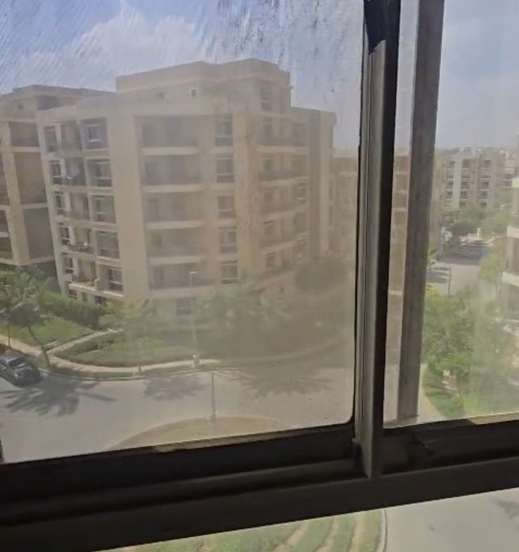 Window view of neighboring apartment buildings - apartment in Taj City, New Cairo
