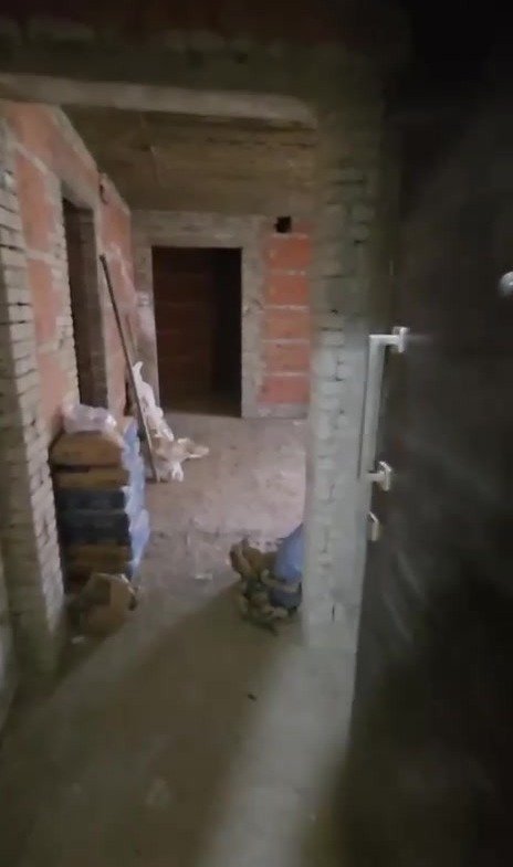 Interior under construction with exposed brick walls - apartment in Taj City, New Cairo