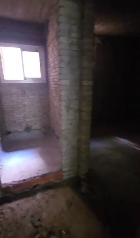 Dark unfinished room with a small window - apartment in Taj City, New Cairo