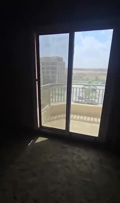 Unfinished room with a balcony door - apartment in Taj City, New Cairo