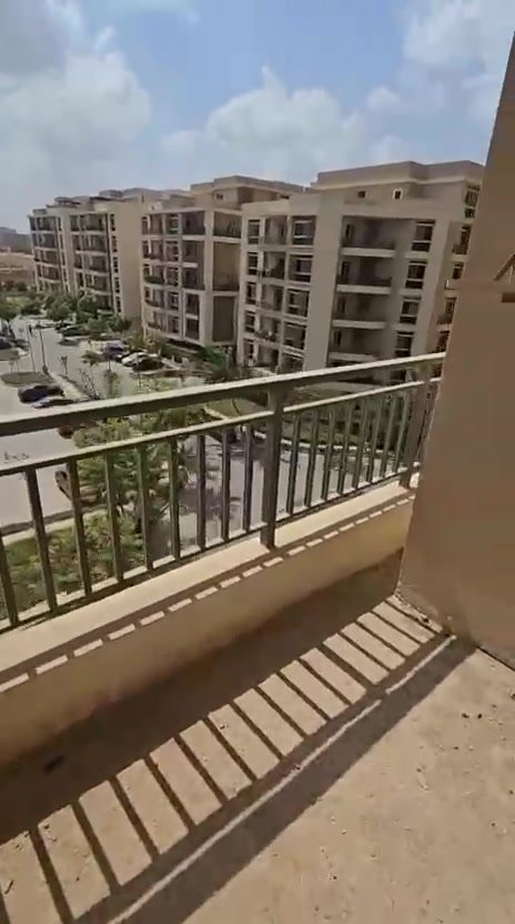 Balcony overlooking landscaped gardens and residences - apartment in Taj City, New Cairo