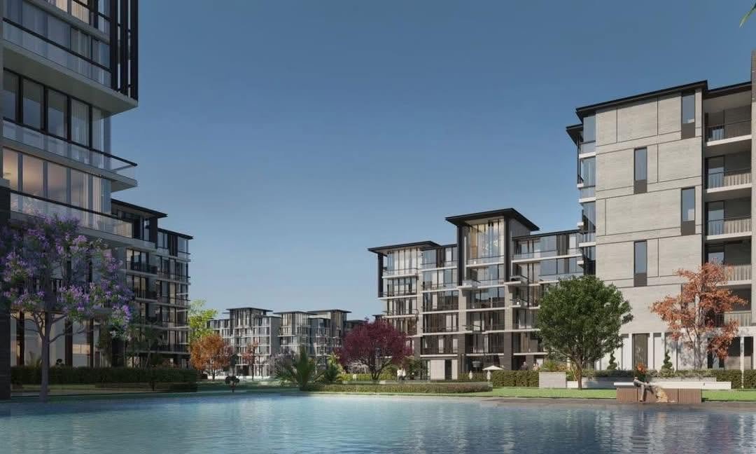 Apartment towers beside a large lake - apartment in The View by Waterway, New Cairo