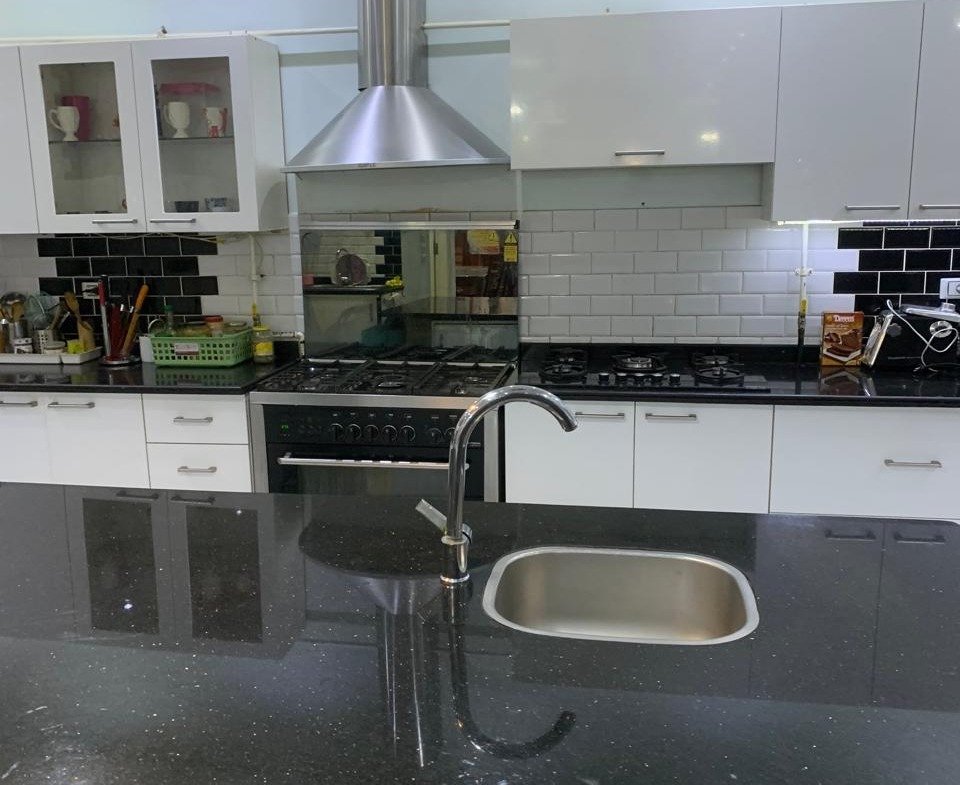 Kitchen island with granite top and sink, Emerald Park twin house