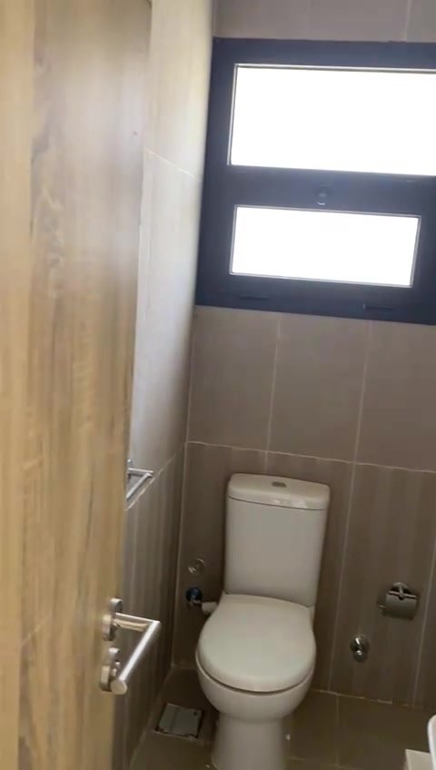Bathroom with toilet and window - apartment in Fifth Square, New Cairo