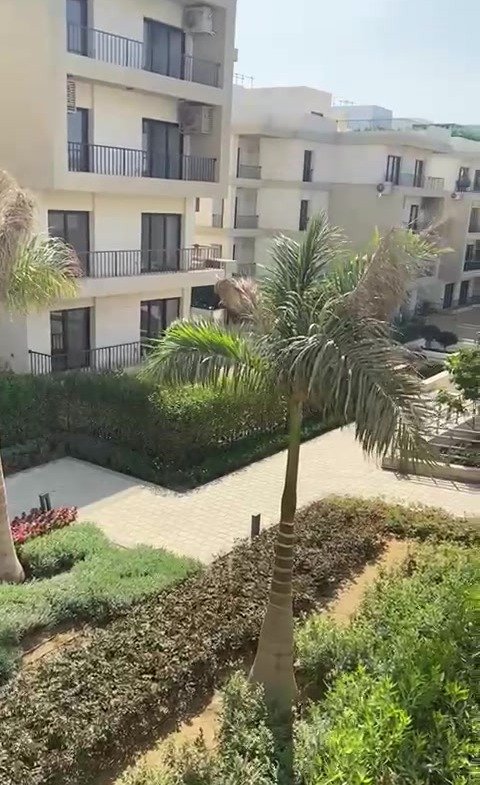 Gardens and apartment buildings from the balcony - apartment in Fifth Square, New Cairo