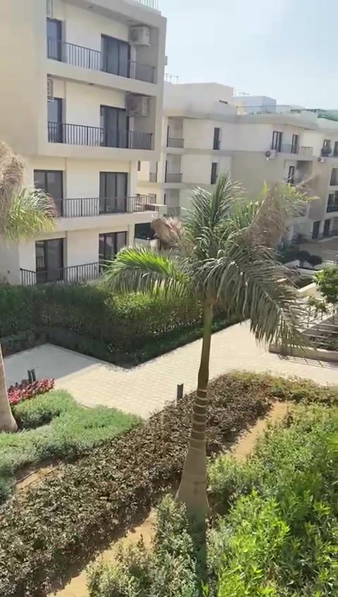 Gardens and apartment buildings from the balcony - apartment in Fifth Square, New Cairo