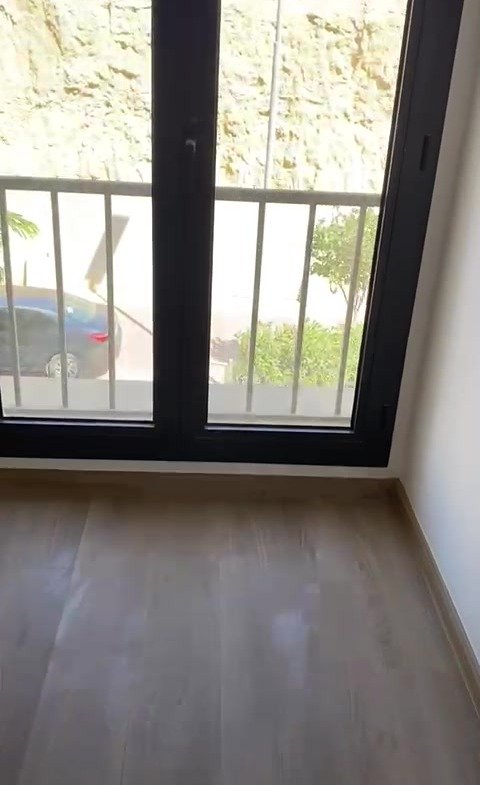 Empty room with balcony window - apartment in Fifth Square, New Cairo
