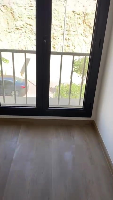 Empty room with balcony window - apartment in Fifth Square, New Cairo