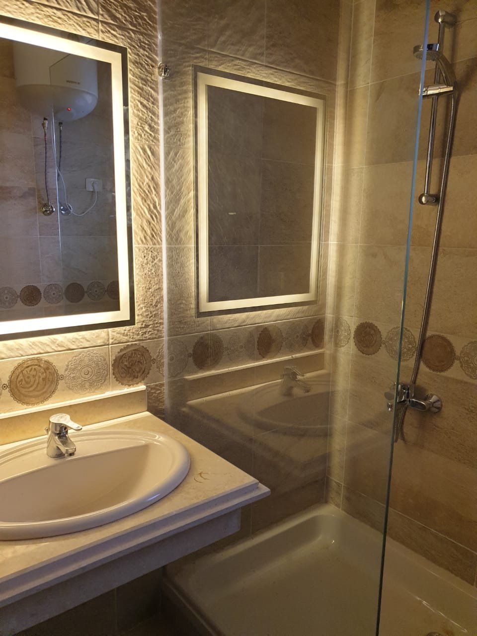 villa-for-rent-telal-ain-sokhna-160-sqm-bathroom Bathroom with illuminated mirror and shower - villa in Telal, Ain Sokhna
